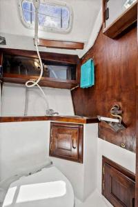 a small bathroom with a toilet and a window at Picturesque Equipped Boat Rental Incredible for a Relaxing Getaway in Florida in Moultrie Junction