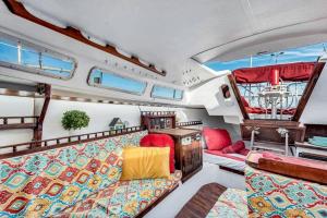 a view of a living room in a boat at Picturesque Equipped Boat Rental Incredible for a Relaxing Getaway in Florida in Moultrie Junction +32 photos