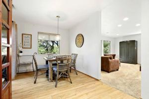 a dining room and living room with a table and chairs at Inspiring Cottage Rental for a Vacation in California Wine Country in Lockeford