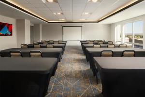 a conference room with chairs and a whiteboard at Hampton Inn & Suites Albuquerque North/I-25 in Albuquerque +30 photos