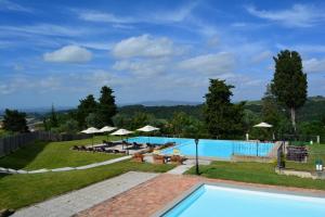 a view of a pool with umbrellas at Villa San Filippo in Barberino di Val dʼElsa +71 photos