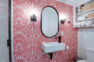 a bathroom with a sink and a mirror at Picturesque Tiny Cabin Surrounded by Nature in Alabama in Grant