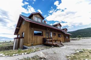 a house on top of a hill with a sky at Scenic Cabin with Wildlife Views Near Madison River, Ennis, Montana in Ennis +33 photos