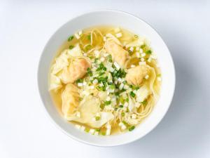 a bowl of chicken noodle soup with dumplings at TRANSCENDER HOTEL Yokohama in Yokohama