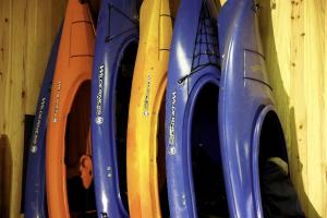 a row of different colored plastic containers on a shelf at Historic One-Room Cabin near Ocala National Forest in Central Florida in Fort McCoy