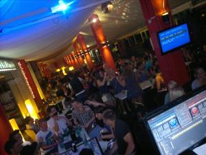 a crowd of people sitting in a bar at Hotel Amalfi in Lido di Jesolo