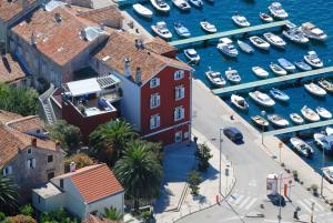 an aerial view of a marina with boats in the water at Mare Mare Suites in Mali Lošinj