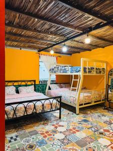 Postel nebo postele na pokoji v ubytování Cà's Garden