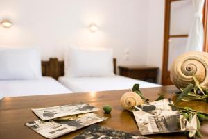 Postel nebo postele na pokoji v ubytování Naftilos Skiathos