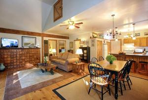 a living room with a table and a couch at Light-Filled, Well-Appointed Mountain Cabin for a Vacation in Wells, Vermont in Wells +31 photos