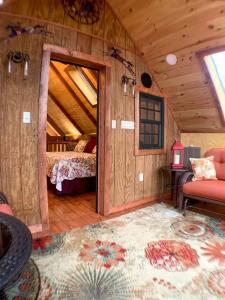 a room with a bedroom with a bed and a doorway at Magical Tree House Experience with a Private Hot Tub in Shenandoah Valley, Virginia in Grove Hill +14 photos