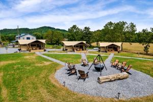 an aerial view of a playground with chairs and a log at Beautiful Secluded Tented Cabin with Fire Pit in Sevierville, Tennessee in Wear Valley