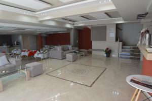 a lobby with couches and chairs and a table at SunSea Hotel Petra in Petra