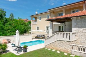 a villa with a swimming pool and a house at Villa Coridigo - Unique High Position, Panorama Nature View, Cozy Dining Terrace, Fenced Property in Kringa