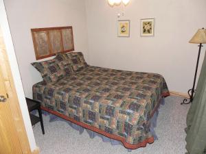 a hotel room with a bed in a bedroom at Luxury Mountain Cabin Rental with a Hot Tub in Helen, Georgia in Helen