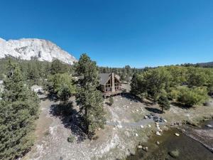 an aerial view of a house in the woods at Stunning Mountainside Cabin Rental with a View Nestled in the Heart of the Colorado Rockies in Nathrop