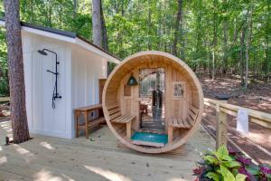 a wooden hobbit house in the woods at Breathtaking Treehouse with Barbecue and Hot-tub in Scottsboro, Alabama in Grant