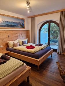 Ένα ή περισσότερα κρεβάτια σε δωμάτιο στο Bergwild