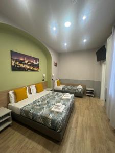 Postel nebo postele na pokoji v ubytování Hotel Camilla Guelfa + 64 fotografií