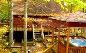 a cabin with a hot tub and a gazebo at Wooded & Fabulous Brown County Cabin with Hot Tub Near Nashville, IN in Nashville