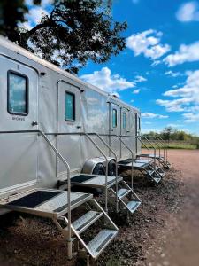 a silver trailer parked on the side of a road at Gorgeous Glamping Site on the San Marcos River: Family-Friendly Safari Tent near Kingsbury, Texas in Staples +51 photos