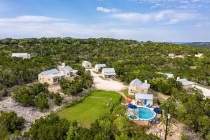 an aerial view of a home with a swimming pool at Entire Property Rental for Large Groups Sleeping 40+ Guests with Pool and Fire Pit in Texas Hill Country near Austin, Texas in Hammetts Crossing