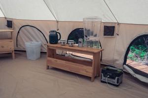 a tent with a table and a blender in it at Carson Glamping Escapes in this Wonderful Bell Tent Rental in Washington in Carson