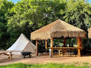 a tent and a table and a tent with a teepee at Tent #L & Cabana #17's Ultimate Family Glamping Getaway in Kingsbury, TX in Second Crossing