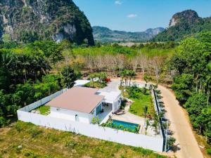 an aerial view of a white house in the jungle at Baan Suan pool valley Villa in Ban Nong Thale