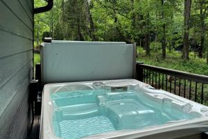 a hot tub sitting on the back of a tent at Stunning Cabin with Spa Perfect for Outdoor Sports in Carbondale, Illinois in Makanda