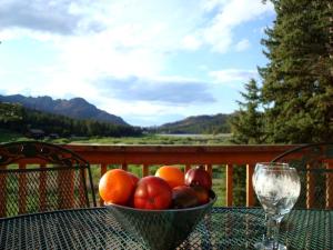 a bowl of fruit sitting on top of a table at Impressive Cabin Rental with Views of Pike National Forest near Colorado Springs, Colorado in Westcreek