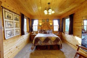 a bedroom with a bed in a wooden room at Western Town Retreat in Monticello, Utah in Verdure