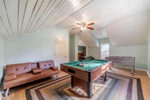 a living room with a pool table and a couch at Serene Cabin with Hot-Tub in Cleveland, Georgia in Kinseytown +21 photos