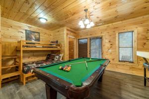 a game room with a pool table in a cabin at Pet-Friendly Cabin with Outdoor Living Space in Cleveland, Georgia in Rogers Mill
