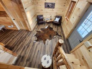 an overhead view of a cabin with a table and chairs at Lakeview Cabin by Tappan Lake, Perfect for Groups with Hot-Tub in Ohio in Deersville +29 photos