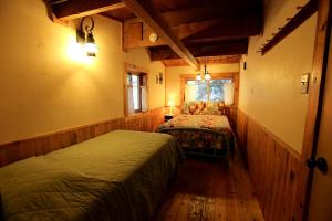 a bedroom with two beds and a window at Secluded Cabin Rental with Mountain Views in Clark, Northern Colorado in Columbine