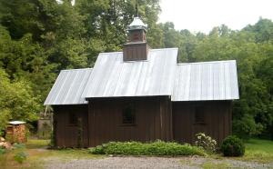 a barn with a clock tower on top of it at Unique Accommodation with Sauna for a Glamping Experience near Nantahala River, North Carolina in Marble