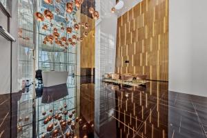 a lobby with a glass wall and a chandelier at The first skyscraper in Slovakia in Bratislava