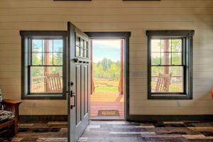 an open door to a house with a porch at Stunning Cottage Rental Ideal for a Family to Go Glamping in Georgia in Shirley Grove +29 photos