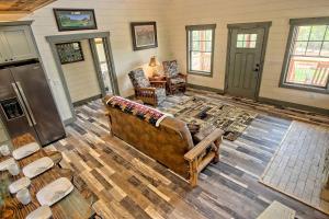 a living room with a couch and a table at Stunning Cottage Rental Ideal for a Family to Go Glamping in Georgia in Shirley Grove