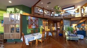 a dining room with a table and chairs in a house at Luxury Mountain Cabin Rental on Rockfish Gap River near Charlottesville, Virginia in Wintergreen