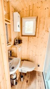 a small bathroom with a sink and a toilet at Wonderful Tiny House Perfect for a Unique Glamping Experience in Germany in Vorpochten