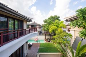 a balcony view of a house with a swimming pool at Sanya Haitang Bay Renguan Sea View Pool Villa (Water World Duty Free City Store) in Sanya