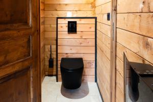 Koupelna v ubytování Les Chalets De Tesa + 13 fotografií