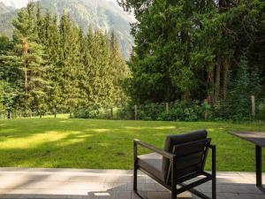 a bench sitting on a patio with a view of a park at Chalet in Krimml near Zillertal Ski Arena in Krimml