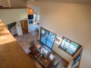 an overhead view of a living room with a table at Tree-House Style Cabin for Rent near Boone, North Carolina in Beech Mountain