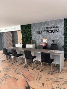 a conference room with a table and chairs at Costa Dreams Costa Adeje in Costa de Adeje +16 photos