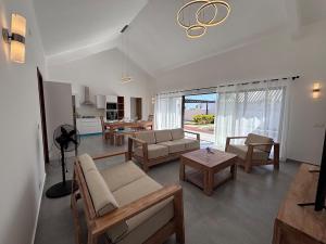 a living room with a couch and a table at The Royal Vista by SOV in Grand-Baie