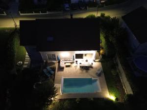 an overhead view of a backyard with a swimming pool at Chez Jo in Le Valdahon