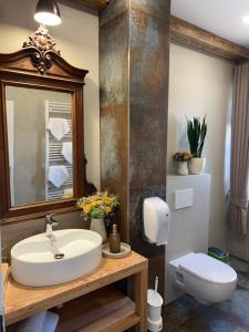 a bathroom with a sink and a toilet at CHATA PoD JAVOROM in Hrabušice +13 photos